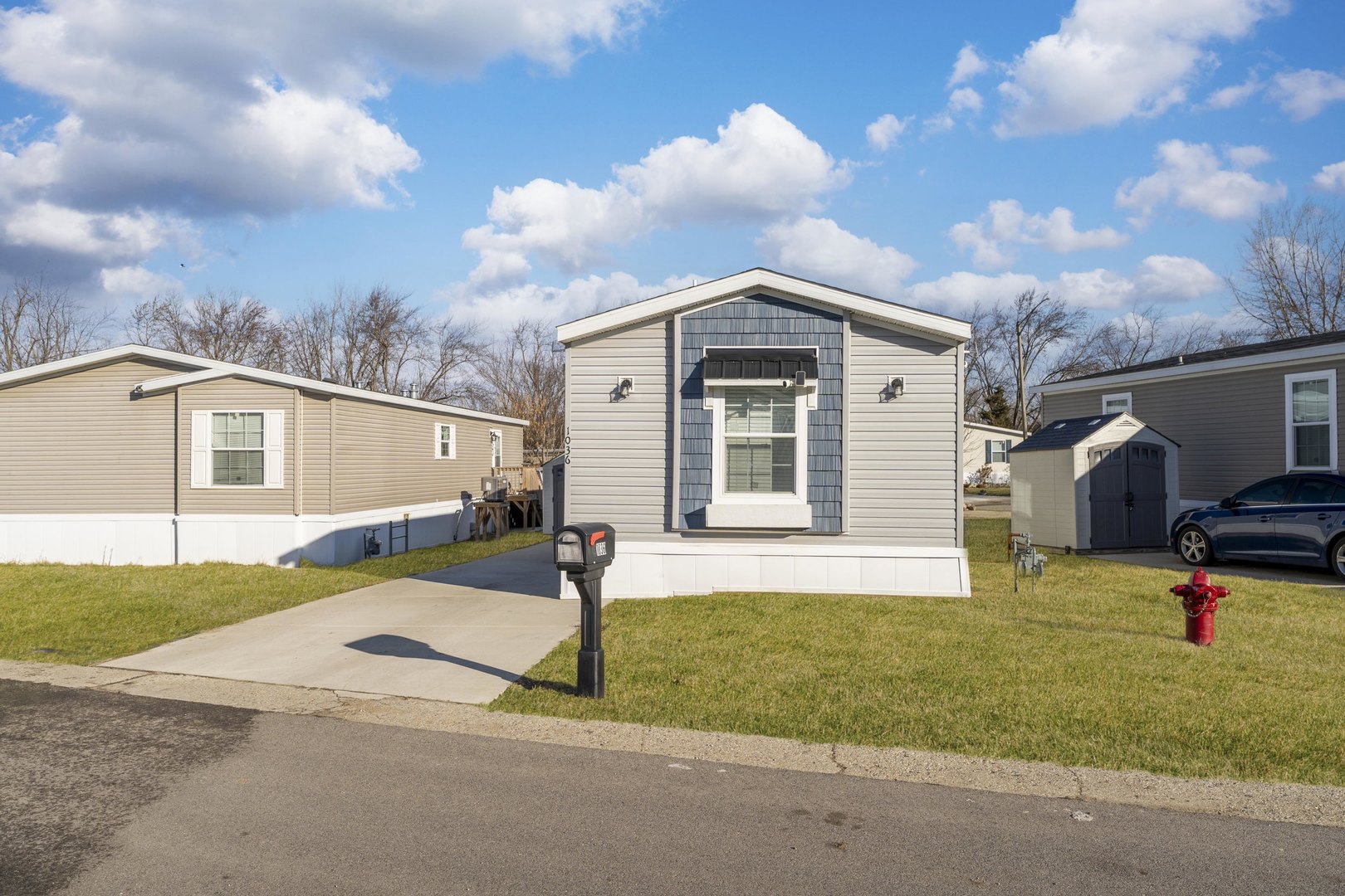 1036 Lunga Drive Round Lake, IL 60073 - Photo 2 of 31 a front view of a house with a yard and garage