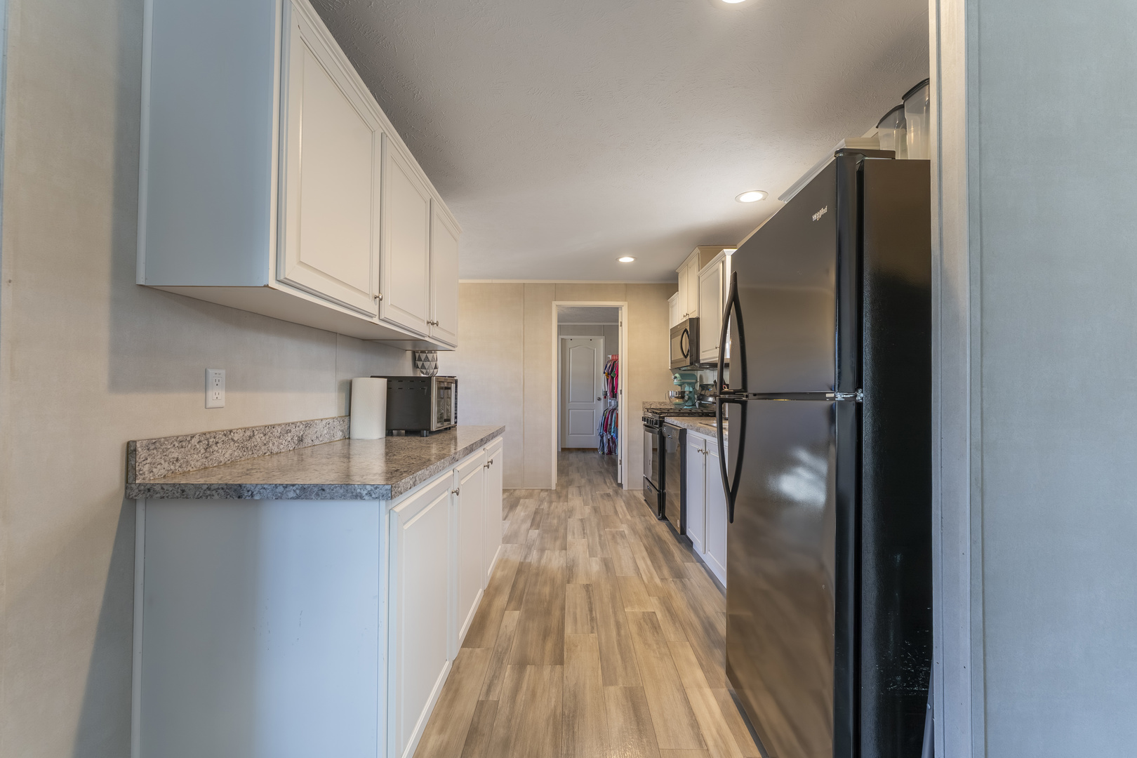 1036 Lunga Drive Round Lake, IL 60073 - Photo 7 of 31 a view of a kitchen with a sink and refrigerator