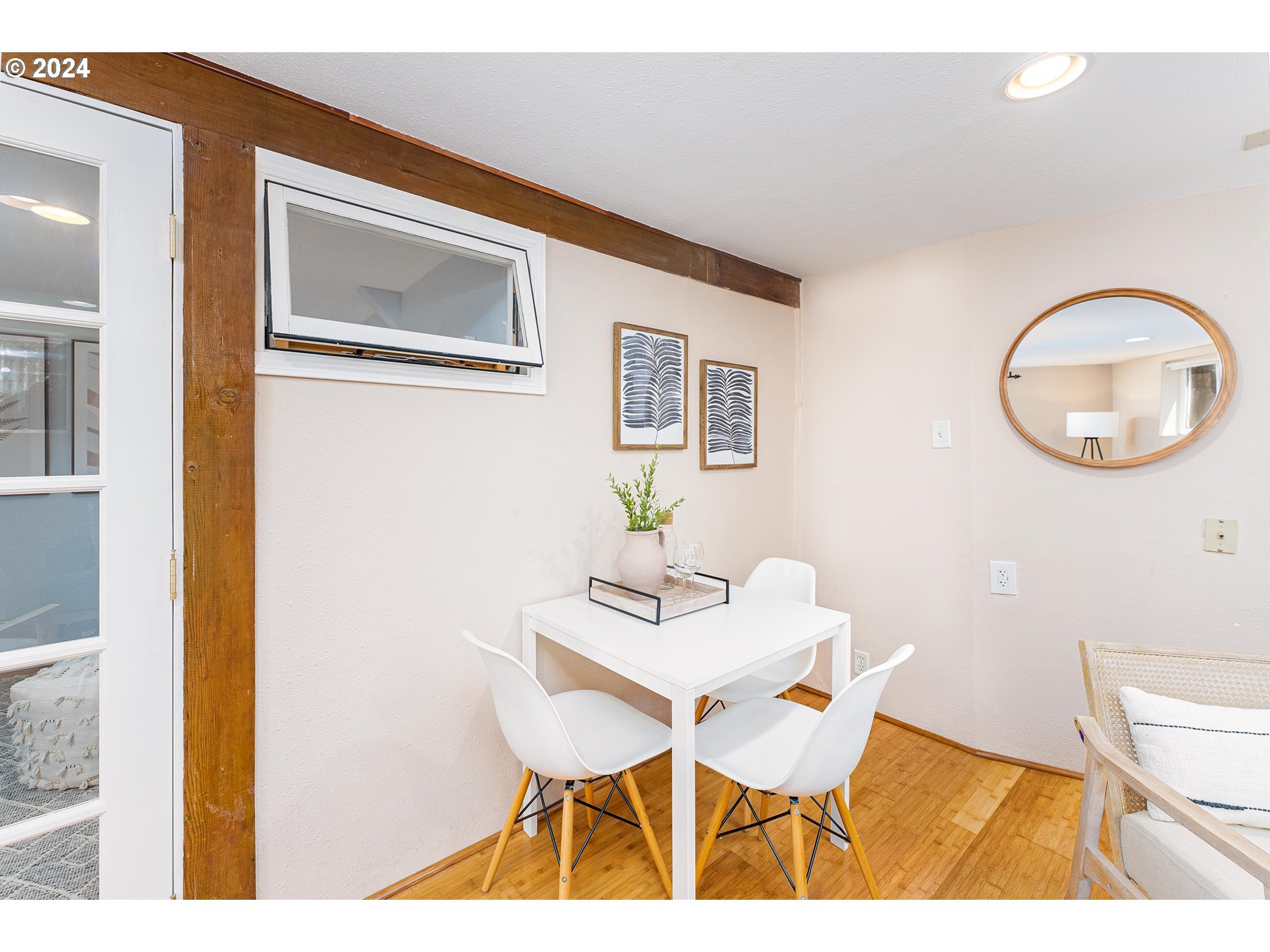 2034 Northwest Overton Street, Unit E Portland, OR 97209 - Photo 9 of 25 a view of a dining room with furniture and wooden floor