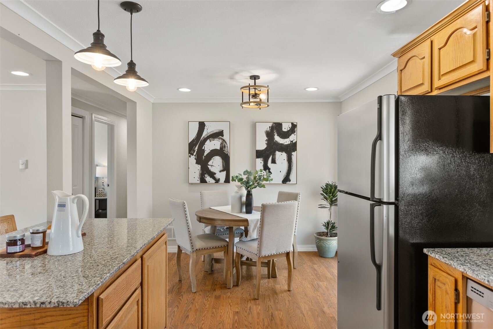 216 Bridgeway Everett, WA 98201 - Photo 21 of 40 a kitchen with stainless steel appliances granite countertop a refrigerator a sink and white cabinets