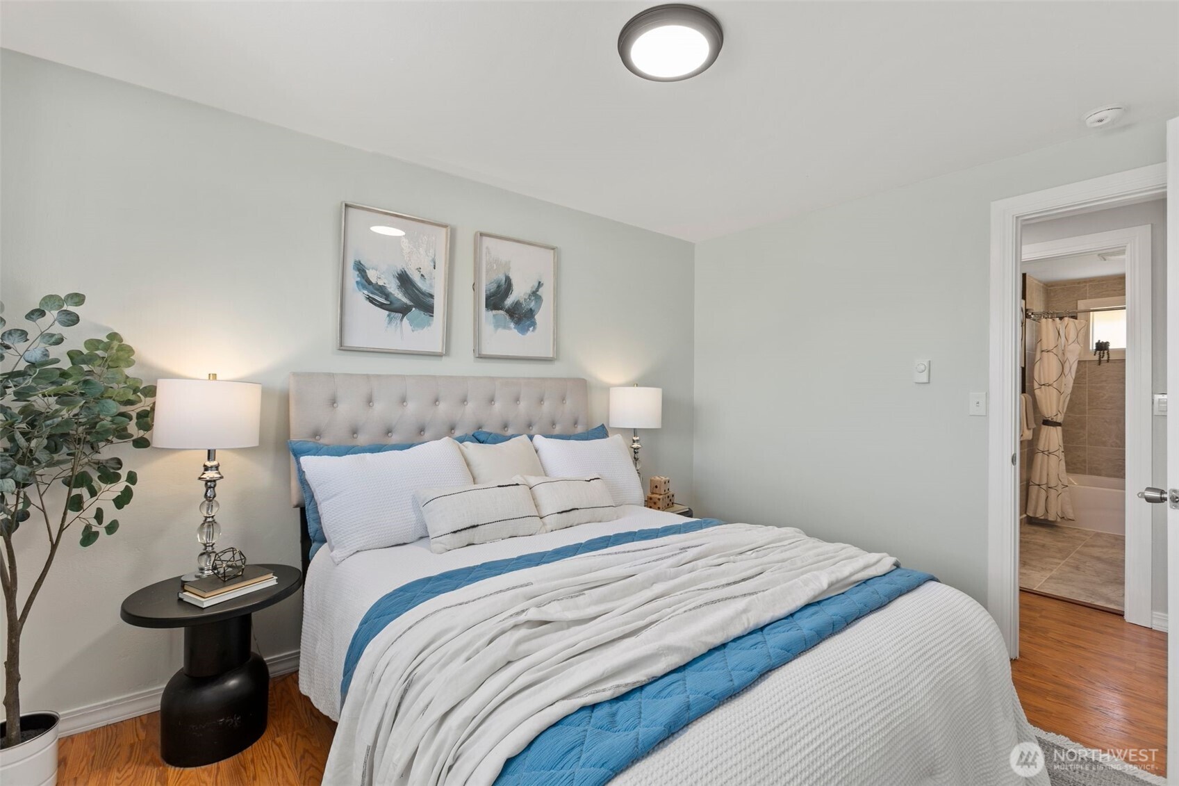 216 Bridgeway Everett, WA 98201 - Photo 23 of 40 a bedroom with bed and painting on the wall