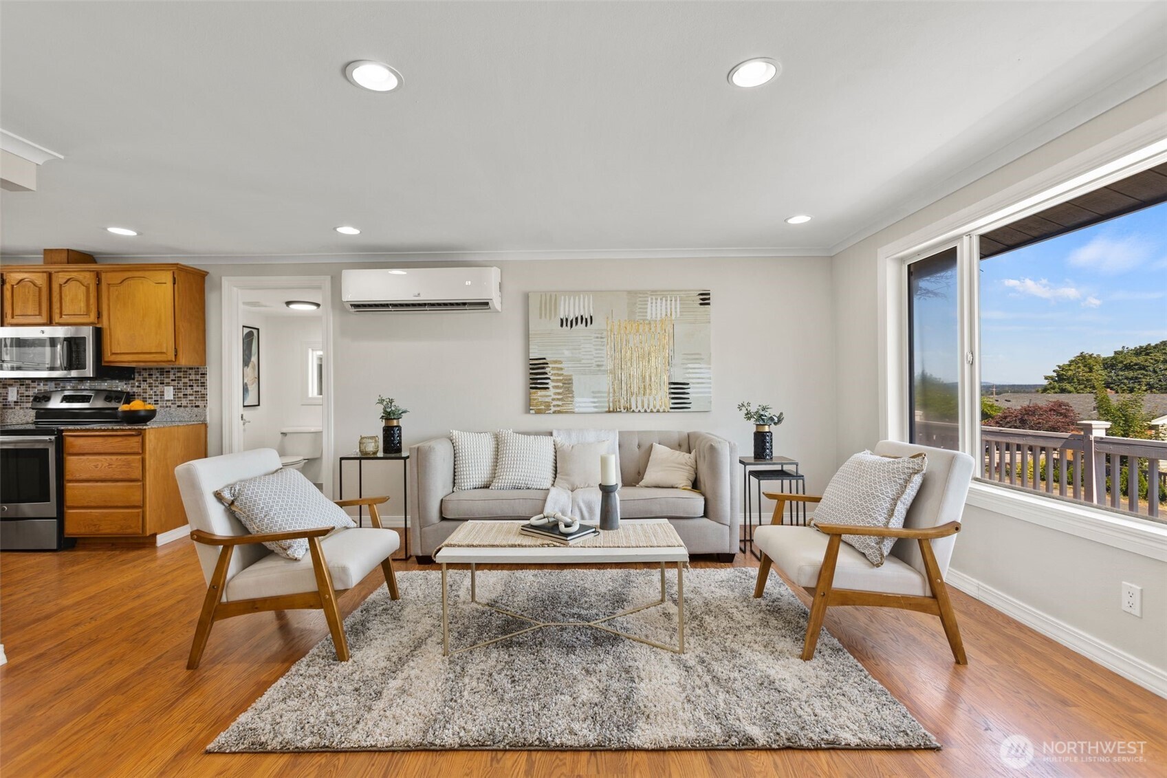 216 Bridgeway Everett, WA 98201 - Photo 8 of 40 a living room with furniture and a rug