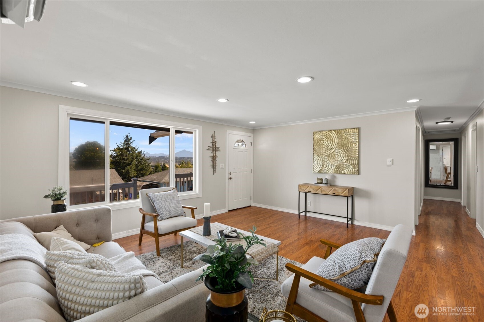 216 Bridgeway Everett, WA 98201 - Photo 10 of 40 a living room with furniture and a large window