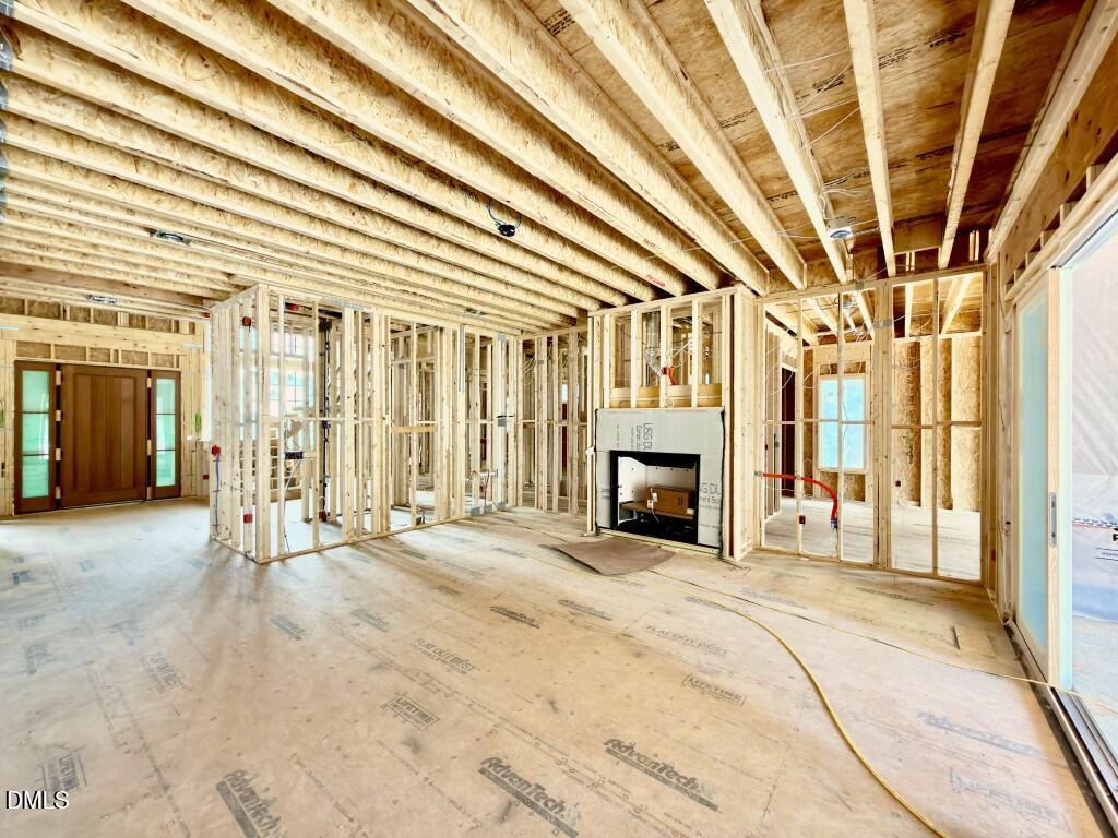 1504 Strothmore Court Raleigh, NC 27615 - Photo 22 of 32 a view of an empty room with a fireplace and a window