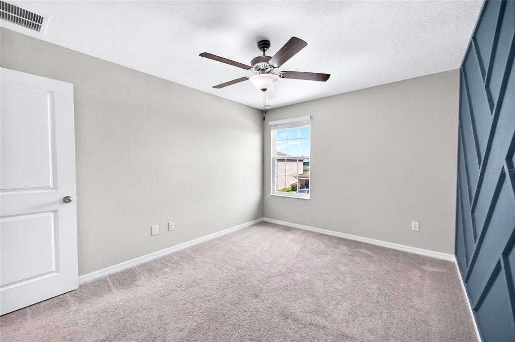 31724 Sun Kettle Loop Wesley Chapel, FL 33545 - Photo 18 of 49 a view of an empty room with a window