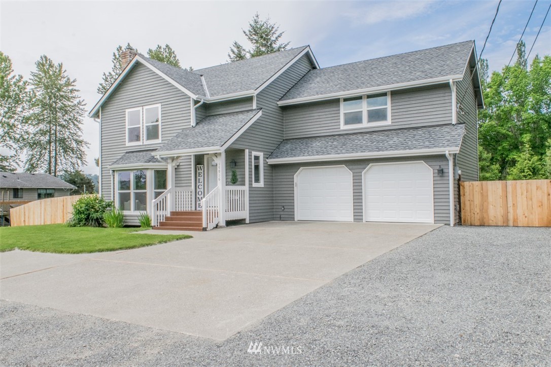 17916 Tester Road Snohomish, WA 98290 - Photo 1 of 28 front view of a house with a yard and a garage