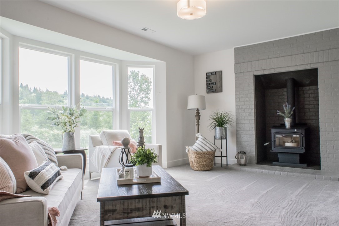 17916 Tester Road Snohomish, WA 98290 - Photo 13 of 28 a living room with furniture and large windows