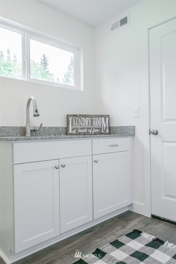 17916 Tester Road Snohomish, WA 98290 - Photo 16 of 28 a view of cabinets with wooden floor