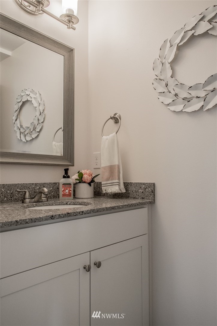 17916 Tester Road Snohomish, WA 98290 - Photo 17 of 28 a bathroom with a sink and a mirror
