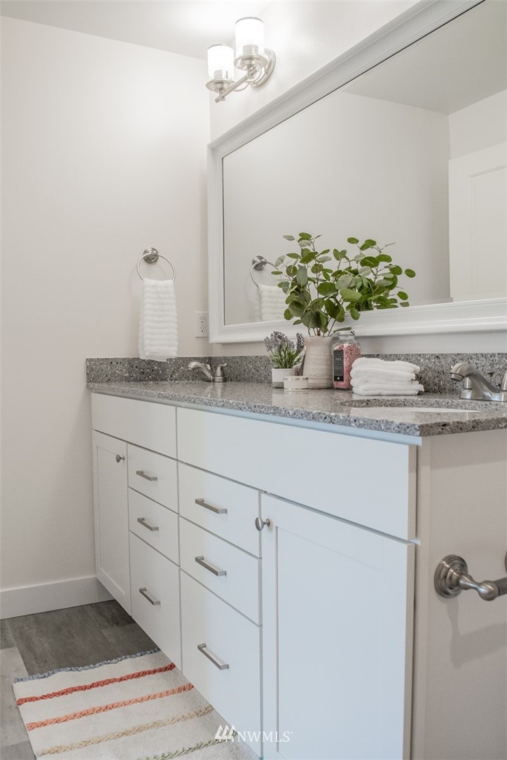 17916 Tester Road Snohomish, WA 98290 - Photo 22 of 28 a bathroom with a sink and mirror