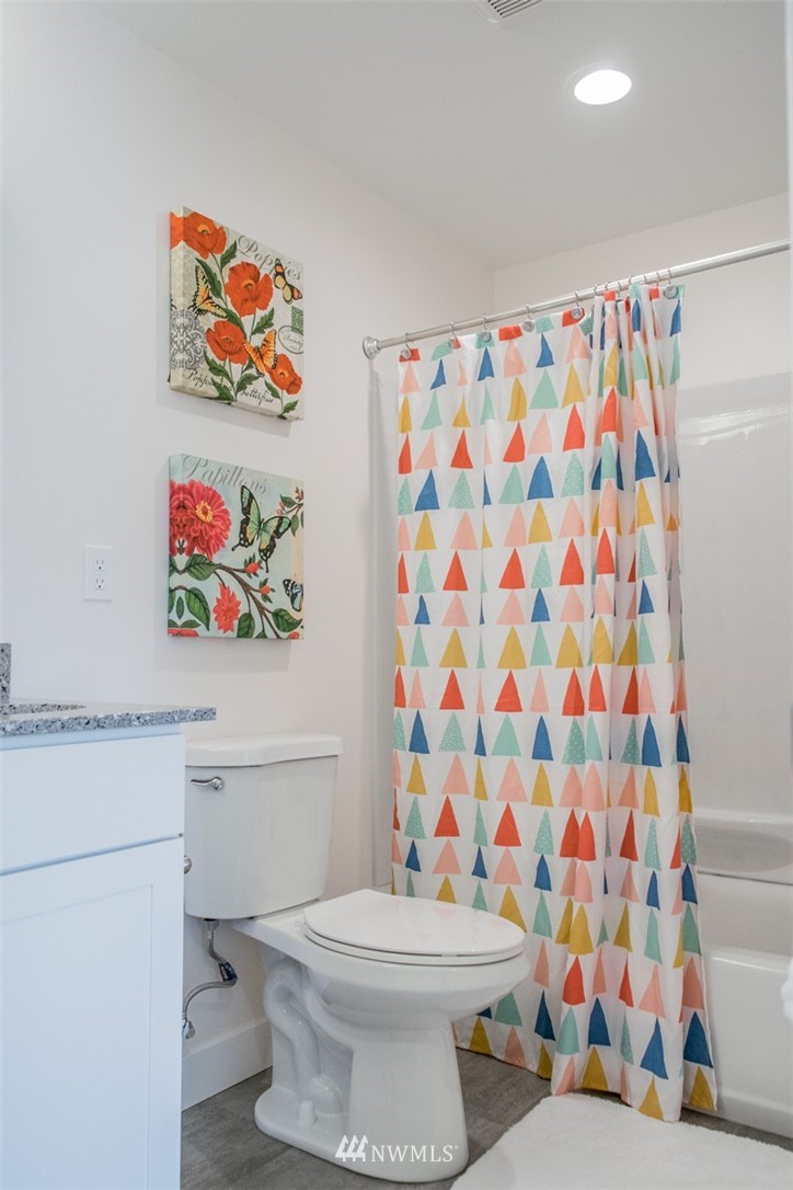 17916 Tester Road Snohomish, WA 98290 - Photo 23 of 28 a bathroom with a toilet and a shower curtain