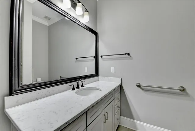 a bedroom with a bed and cabinets