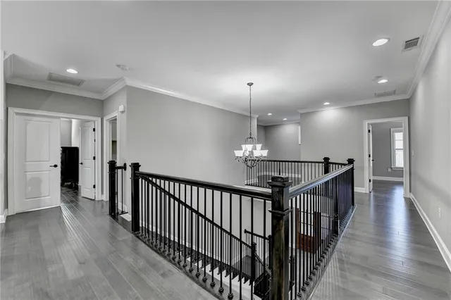 a bathroom with a double vanity sink mirror and bathtub