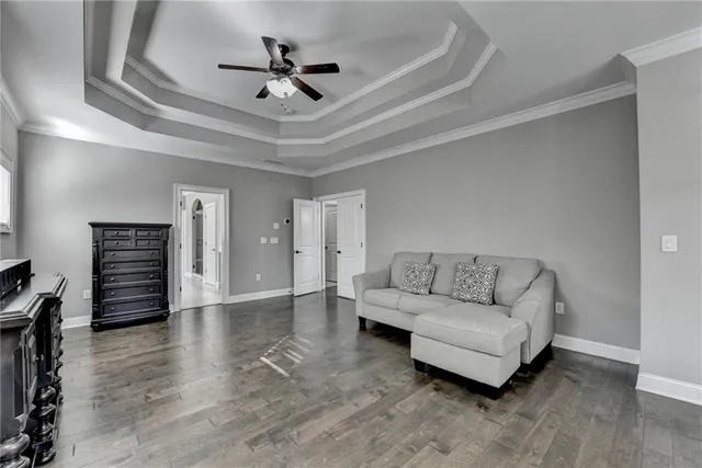 a utility room with stainless steel appliances granite countertop a sink a washer and dryer with wooden cabinets
