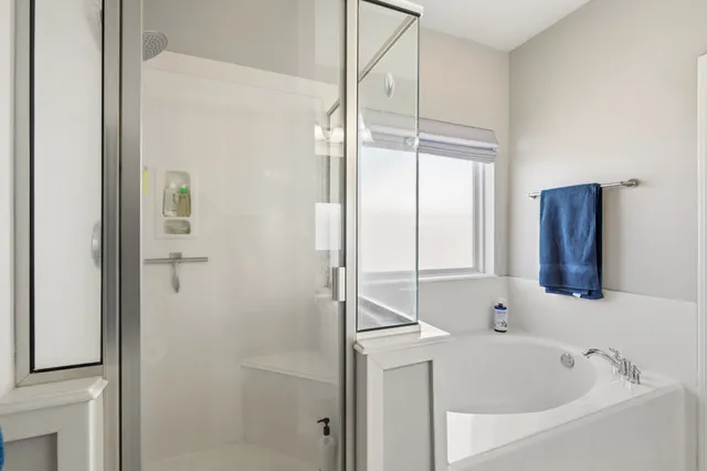 a bathroom with a bathtub and a sink