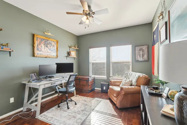 a workspace with furniture and a window