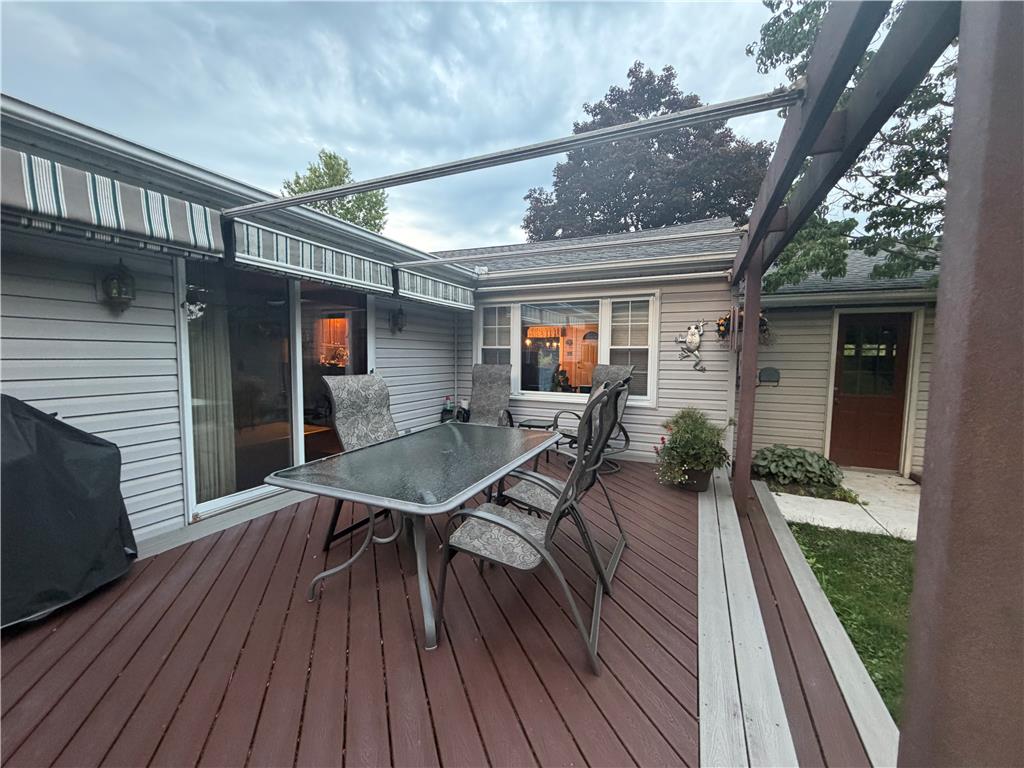 6830 Gun Club Road Coopersburg, PA 18036 - Photo 5 of 30 An inviting outdoor living space features a spacious deck and partial awnings, perfect for relaxation and al fresco dining.