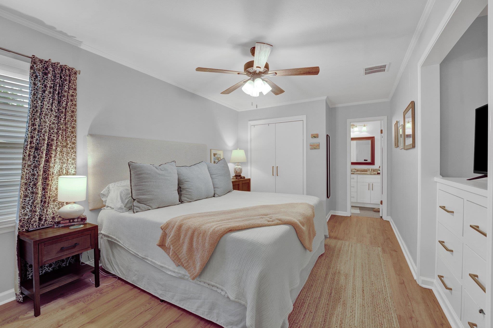 1459 Colonial Road Memphis, TN 38117 - Photo 19 of 33 a bedroom with a bed and a chandelier