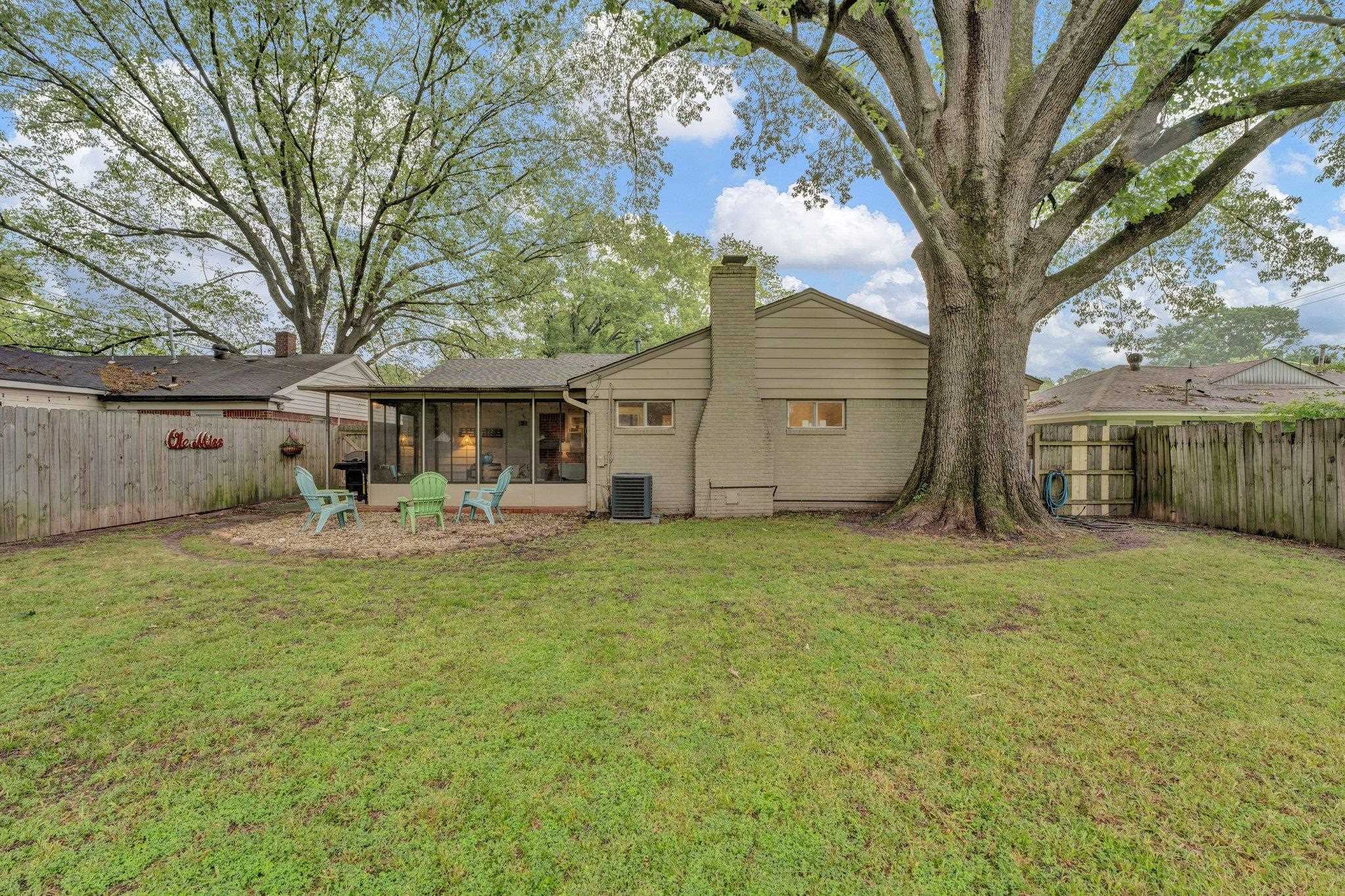 1459 Colonial Road Memphis, TN 38117 - Photo 32 of 33 a view of a house with backyard and sitting area