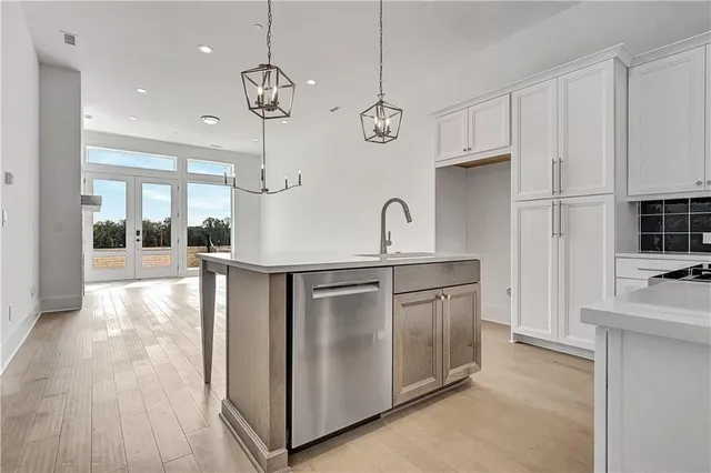 a kitchen with a sink and cabinets