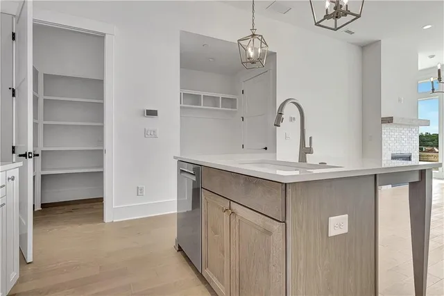 a bathroom with a sink vanity and a mirror