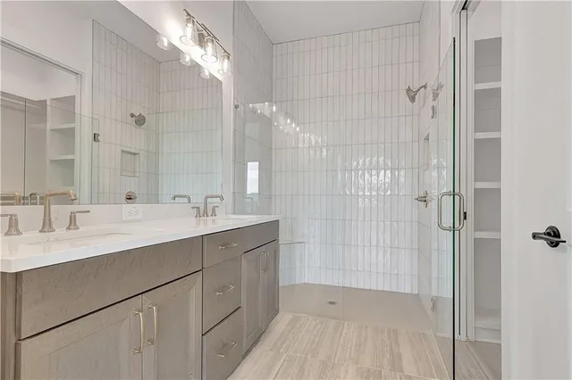 a bathroom with a shower and a sink