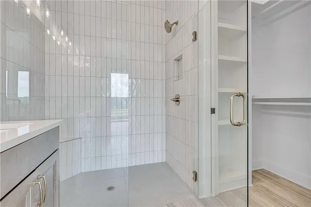 a view of a hallway with wooden floor