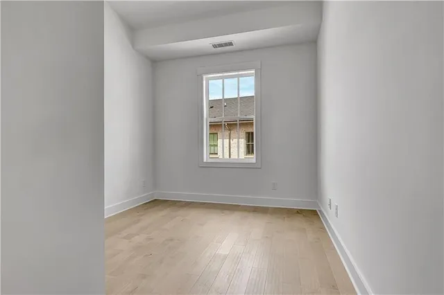 a bathroom with a sink vanity and mirror