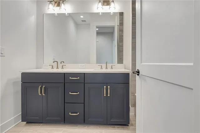 a bathroom with a bathtub and a sink