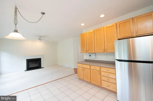 a kitchen with a refrigerator a stove and a microwave