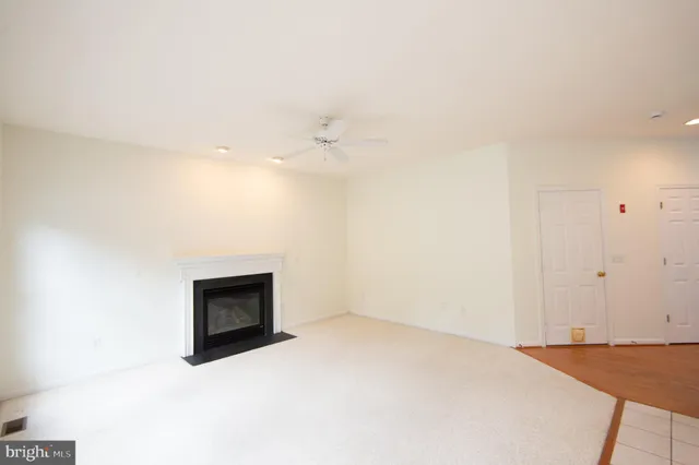 a room with a bed and a fireplace