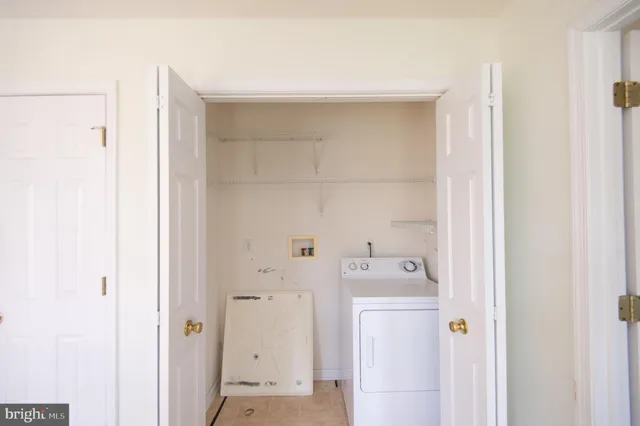 a view of a house with a yard and a garden