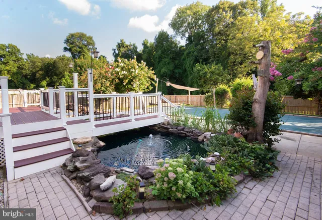 a backyard of a house with a table and chairs