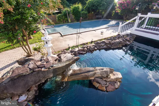 a view of a house with wooden deck