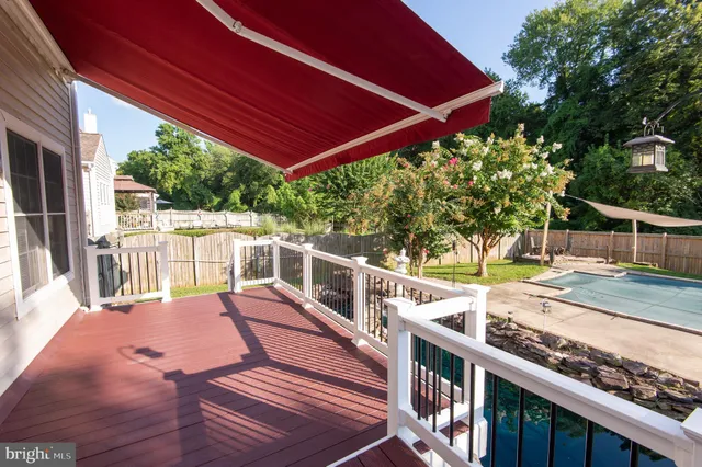 a view of a balcony with wooden floor