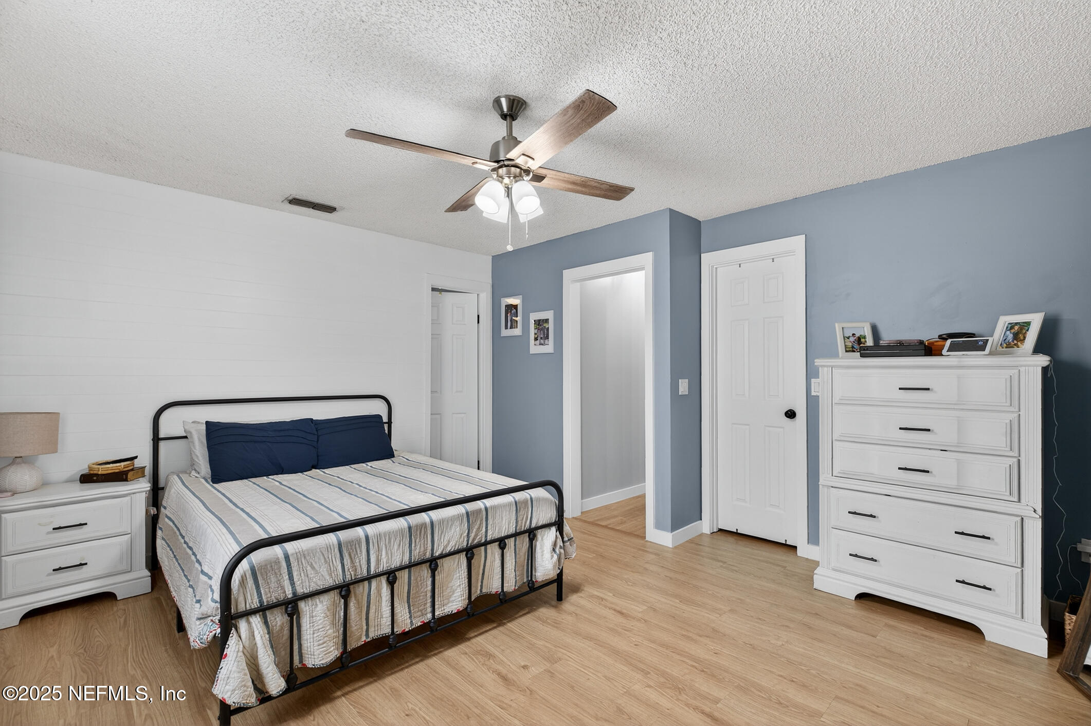2172 Rothbury Drive Jacksonville, FL 32221 - Photo 16 of 28 a bedroom with a bed and cabinet