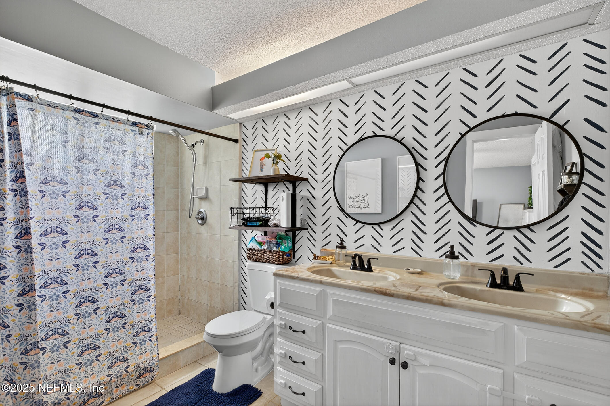 2172 Rothbury Drive Jacksonville, FL 32221 - Photo 17 of 28 a bathroom with a toilet a sink and a mirror