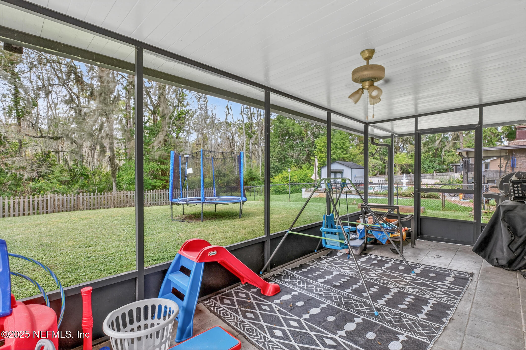 2172 Rothbury Drive Jacksonville, FL 32221 - Photo 23 of 28 a living room with furniture and a floor to ceiling window