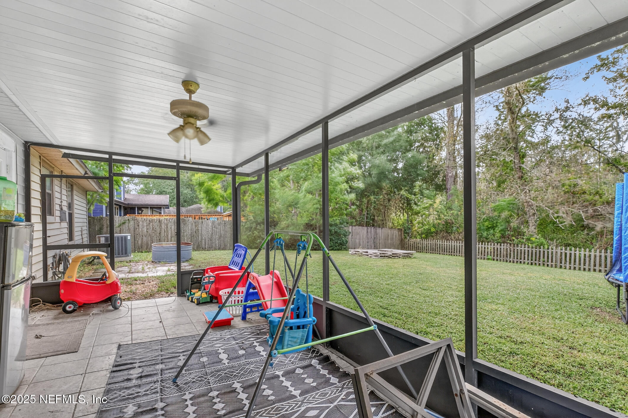2172 Rothbury Drive Jacksonville, FL 32221 - Photo 24 of 28 a living room with patio furniture and garden view