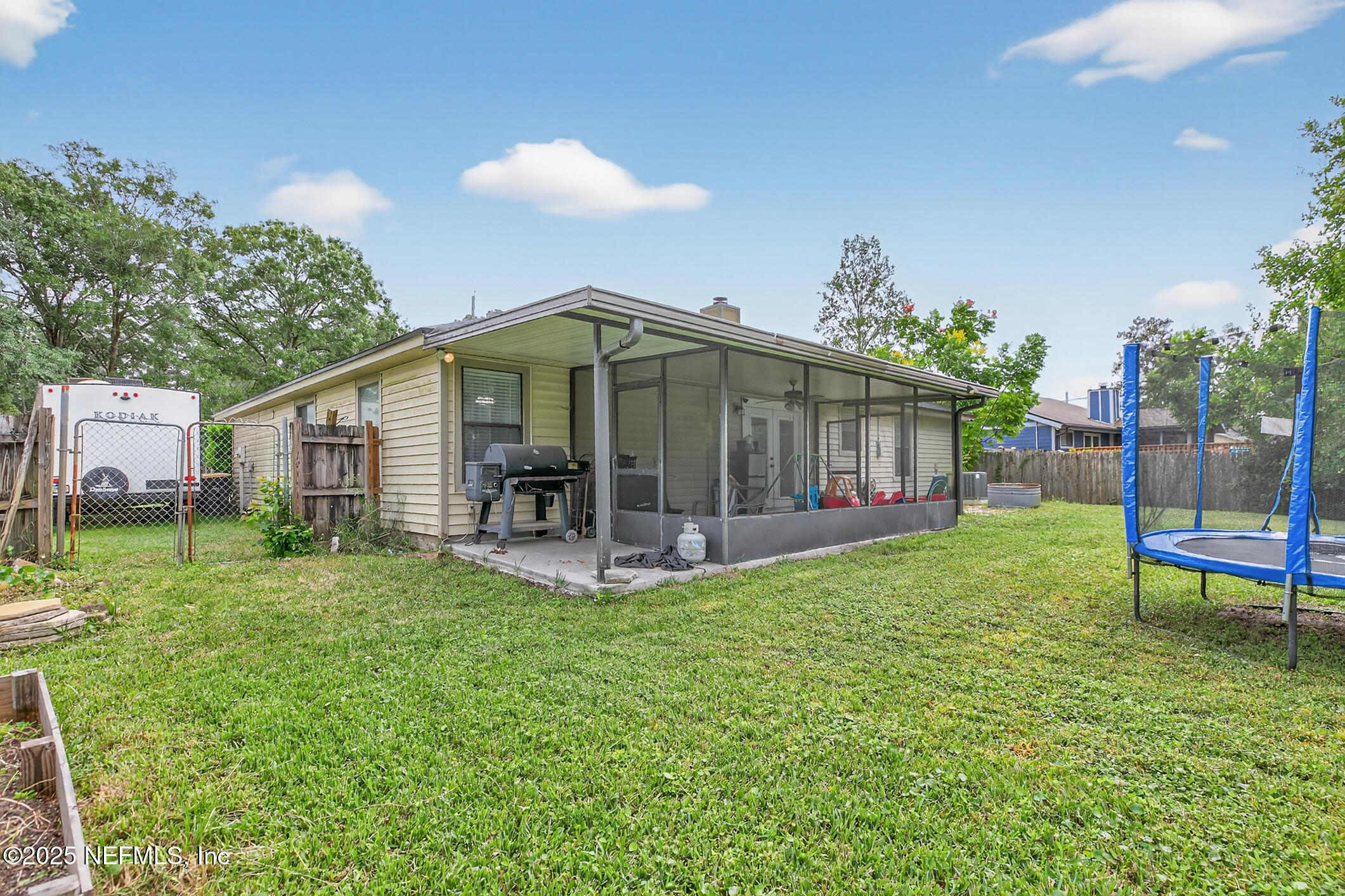 2172 Rothbury Drive Jacksonville, FL 32221 - Photo 26 of 28 a view of a house with a yard and sitting area