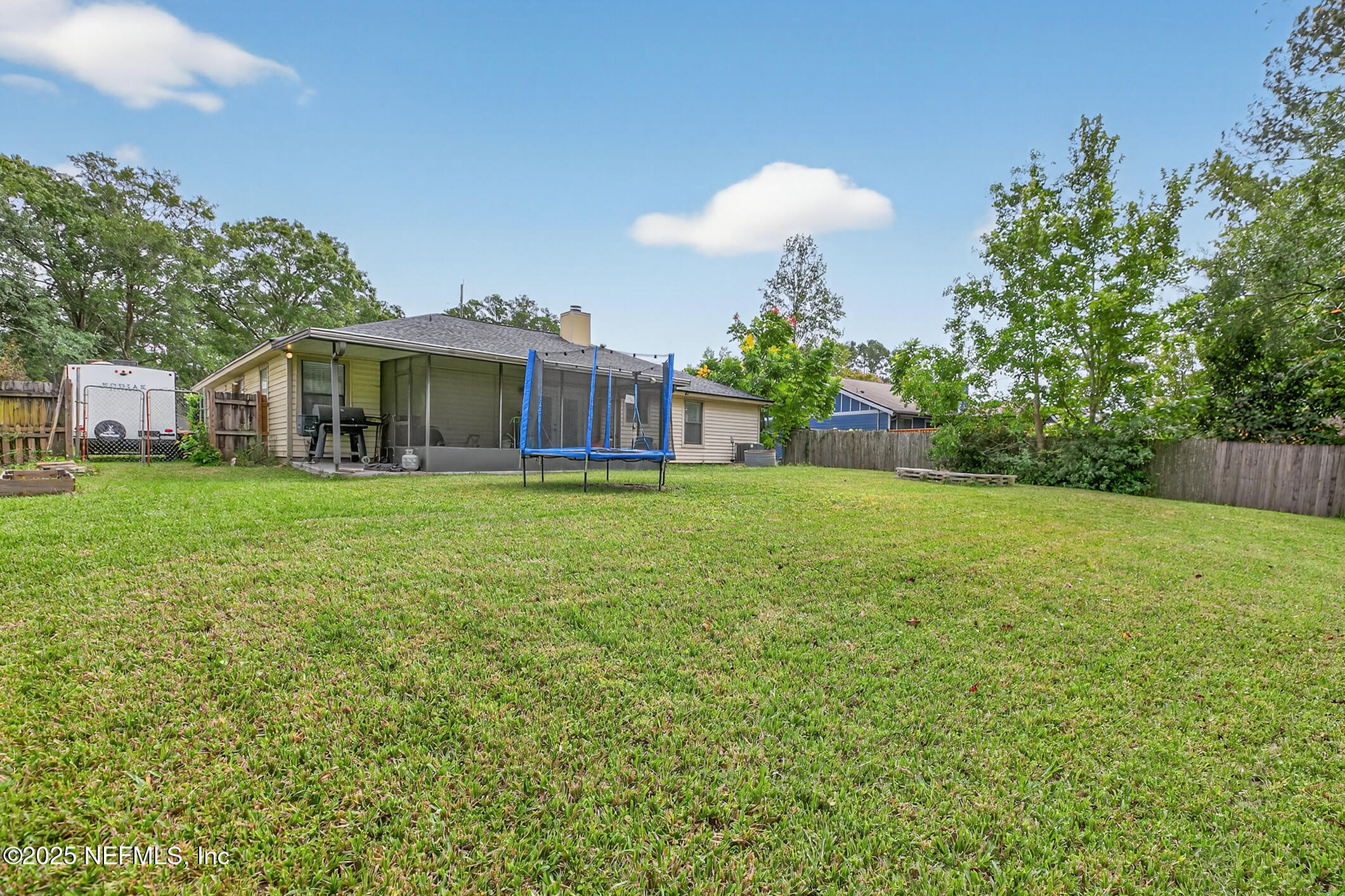2172 Rothbury Drive Jacksonville, FL 32221 - Photo 27 of 28 a view of a house with a yard and sitting area