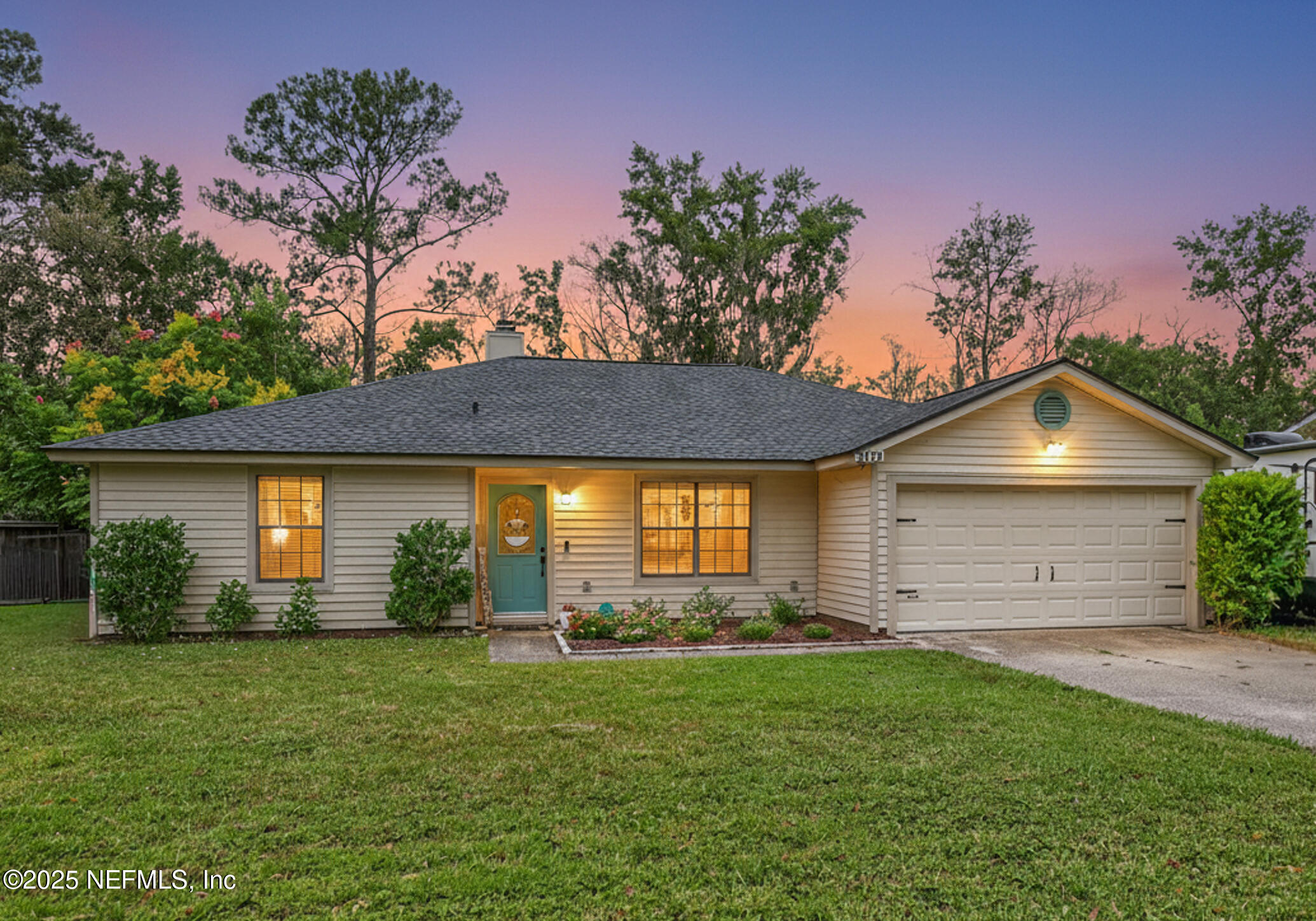 2172 Rothbury Drive Jacksonville, FL 32221 - Photo 28 of 28 a front view of a house with a garden