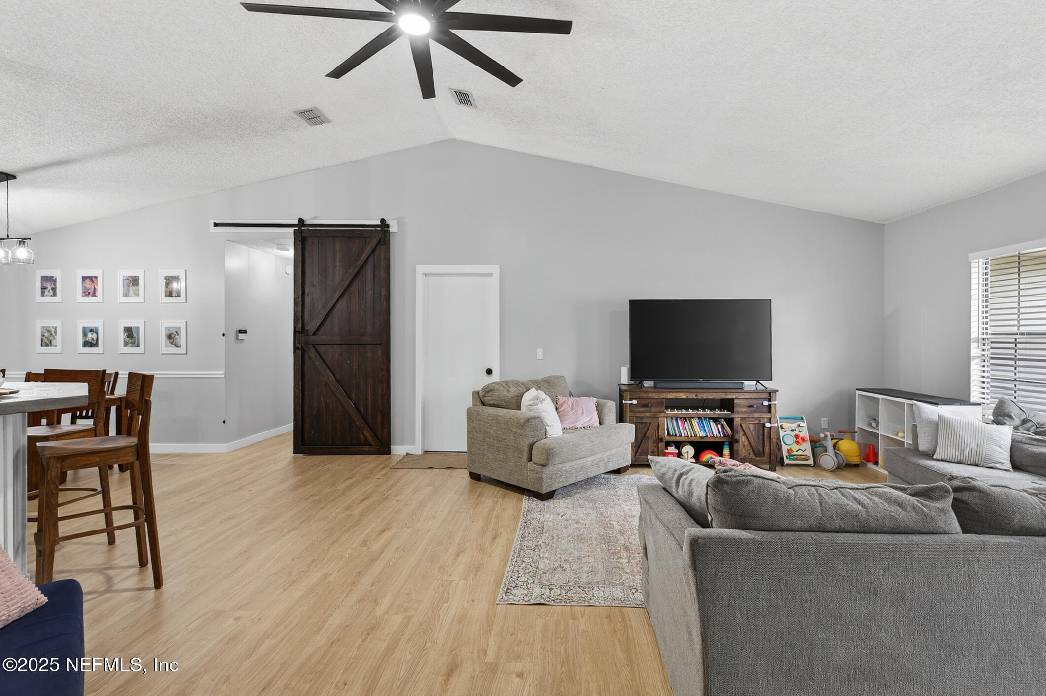 2172 Rothbury Drive Jacksonville, FL 32221 - Photo 6 of 28 a living room with furniture and a flat screen tv