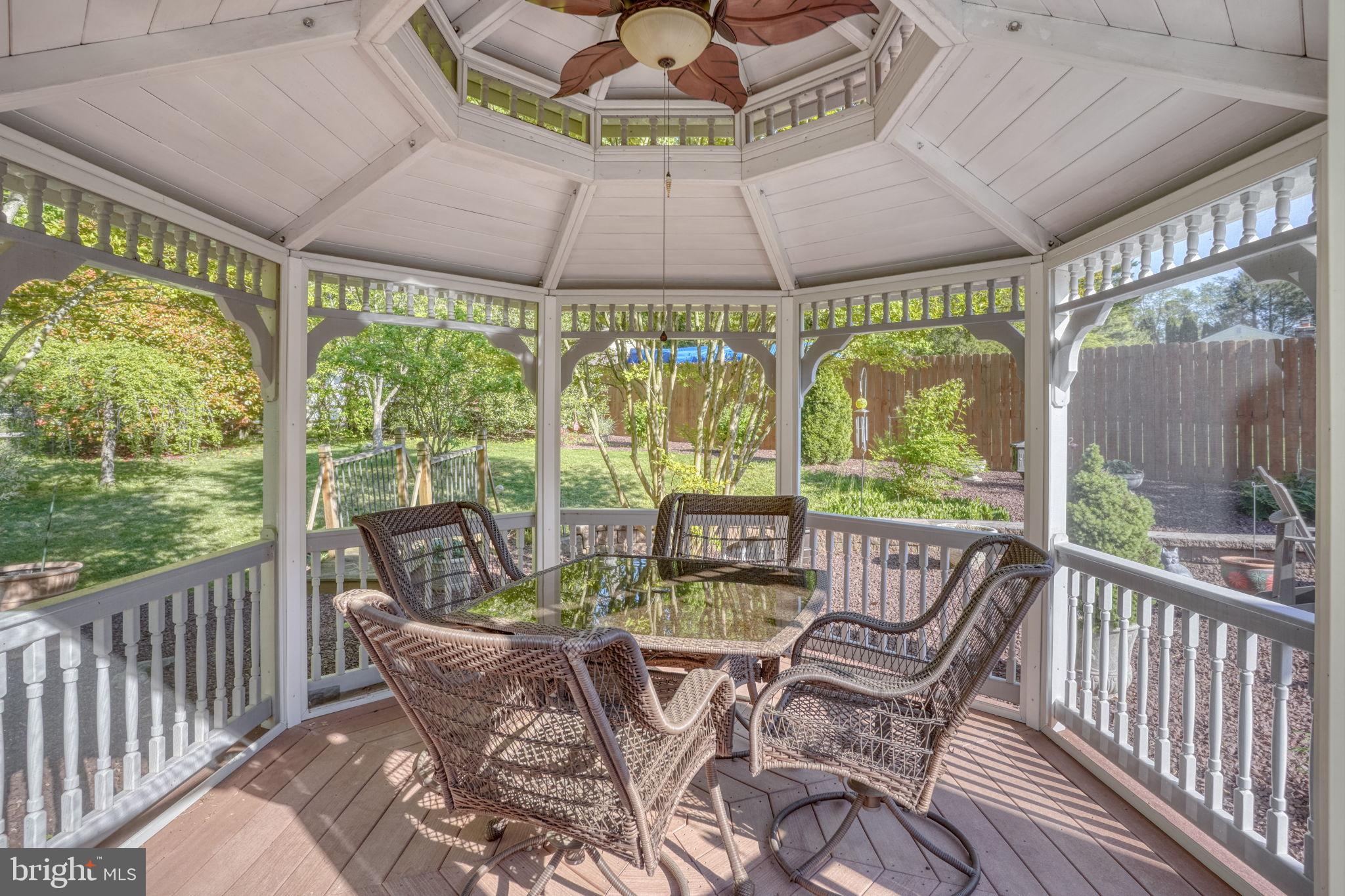 112 Tall Pines Road Newark, DE 19713 - Photo 21 of 62 a view of a patio with a table chairs and a garden