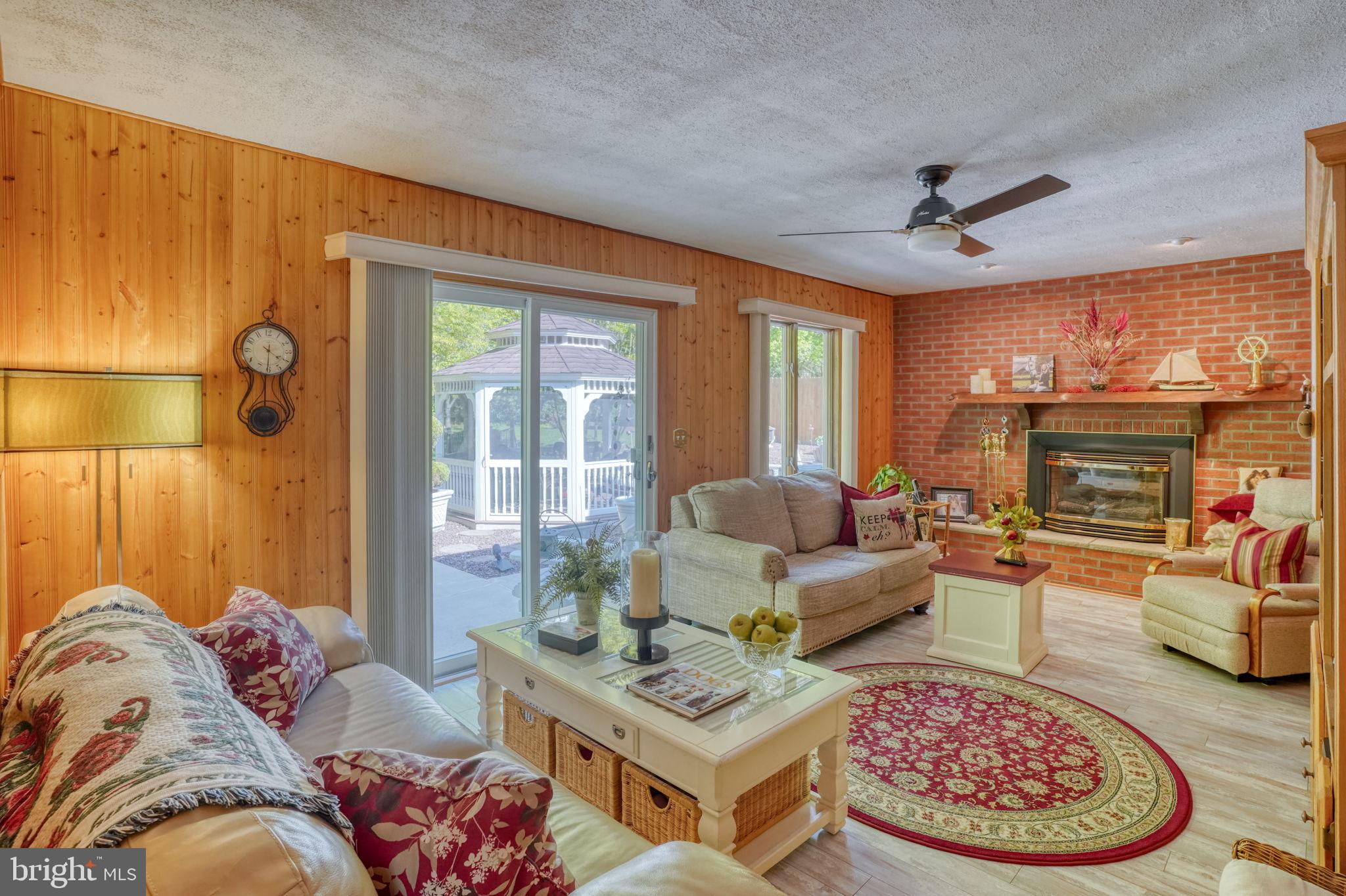 112 Tall Pines Road Newark, DE 19713 - Photo 35 of 62 a living room with furniture and a fireplace