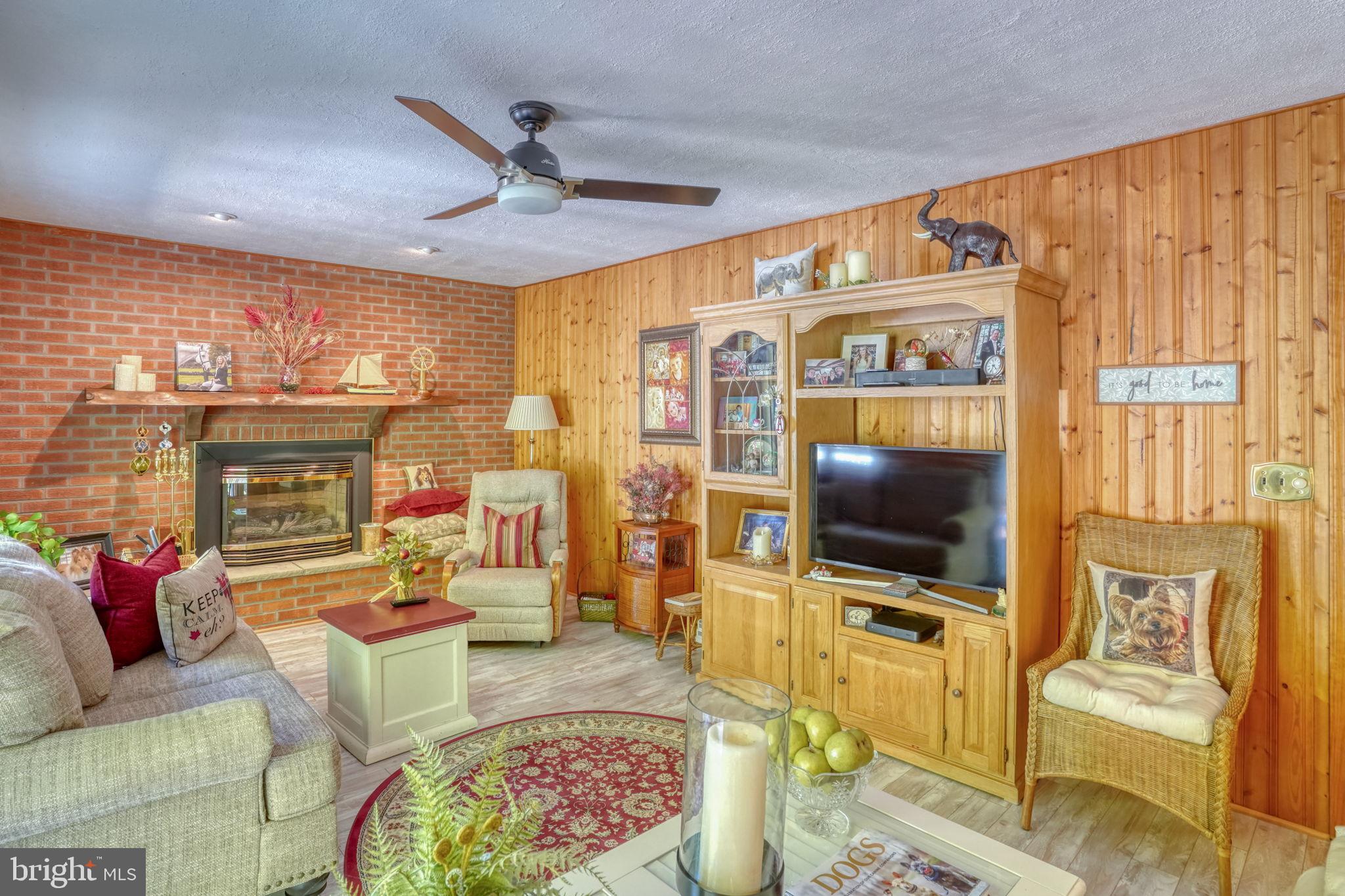 112 Tall Pines Road Newark, DE 19713 - Photo 37 of 62 a living room with furniture and a flat screen tv