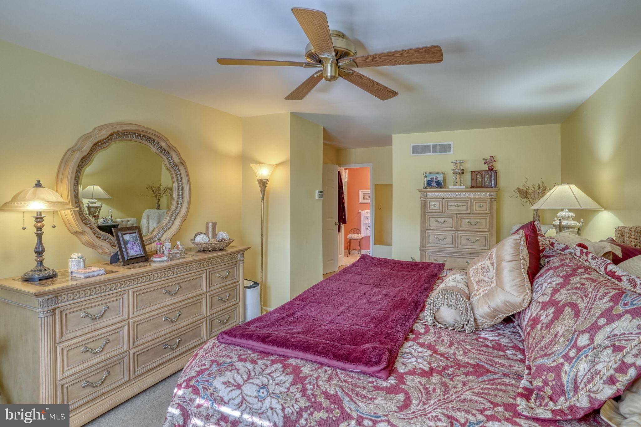 112 Tall Pines Road Newark, DE 19713 - Photo 50 of 62 a bedroom with a bed and a dresser in it