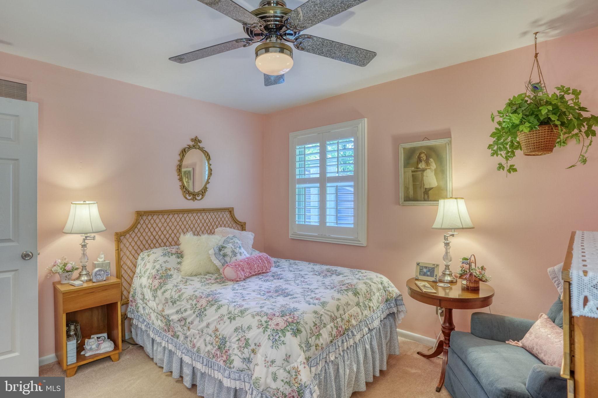 112 Tall Pines Road Newark, DE 19713 - Photo 53 of 62 a bedroom with a bed and a chandelier