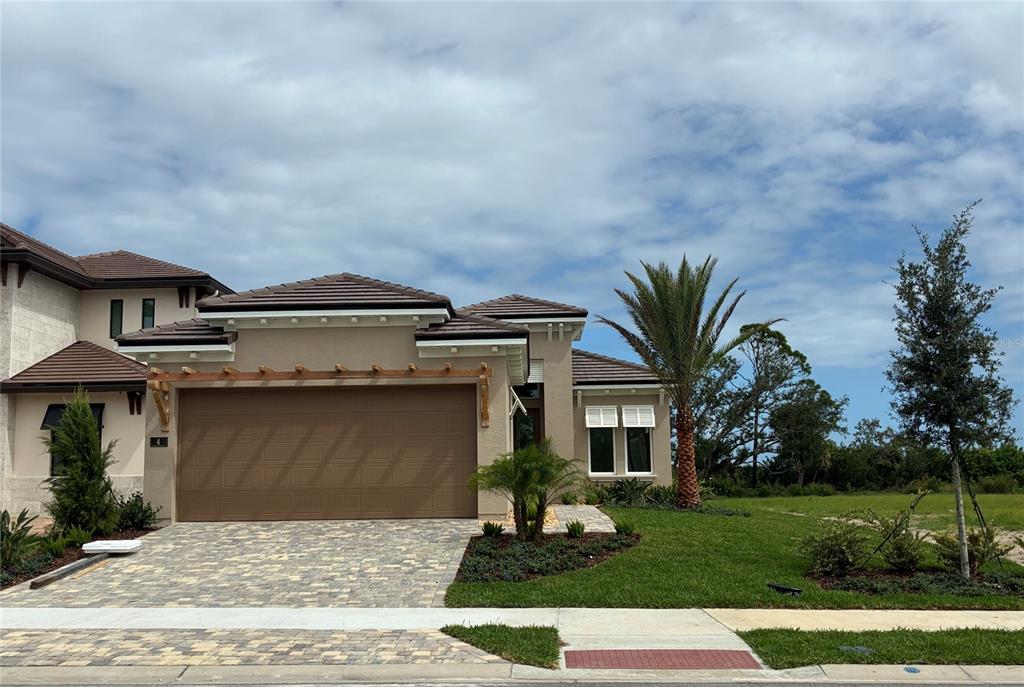 4 Coronado Road Flagler Beach, FL 32136 - Photo 6 of 30 a front view of a house with a garden and yard