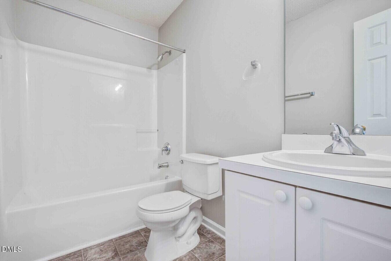 2101 Blackwolf Run Lane, Unit ST Raleigh, NC 27604 - Photo 24 of 30 a bathroom with a sink a toilet and shower
